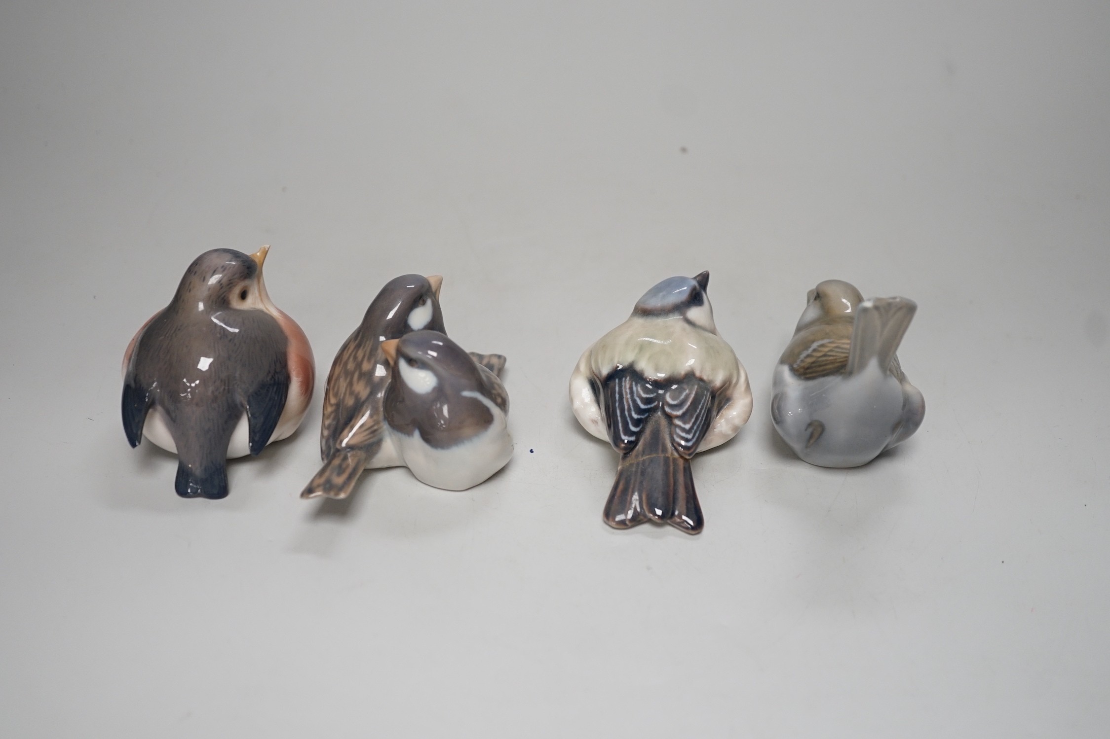 Four Copenhagen models of birds. Tallest 8cm
